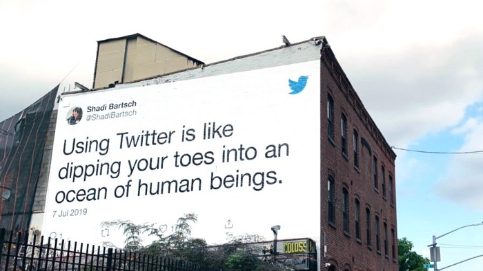 Twitter ad on a building wall.